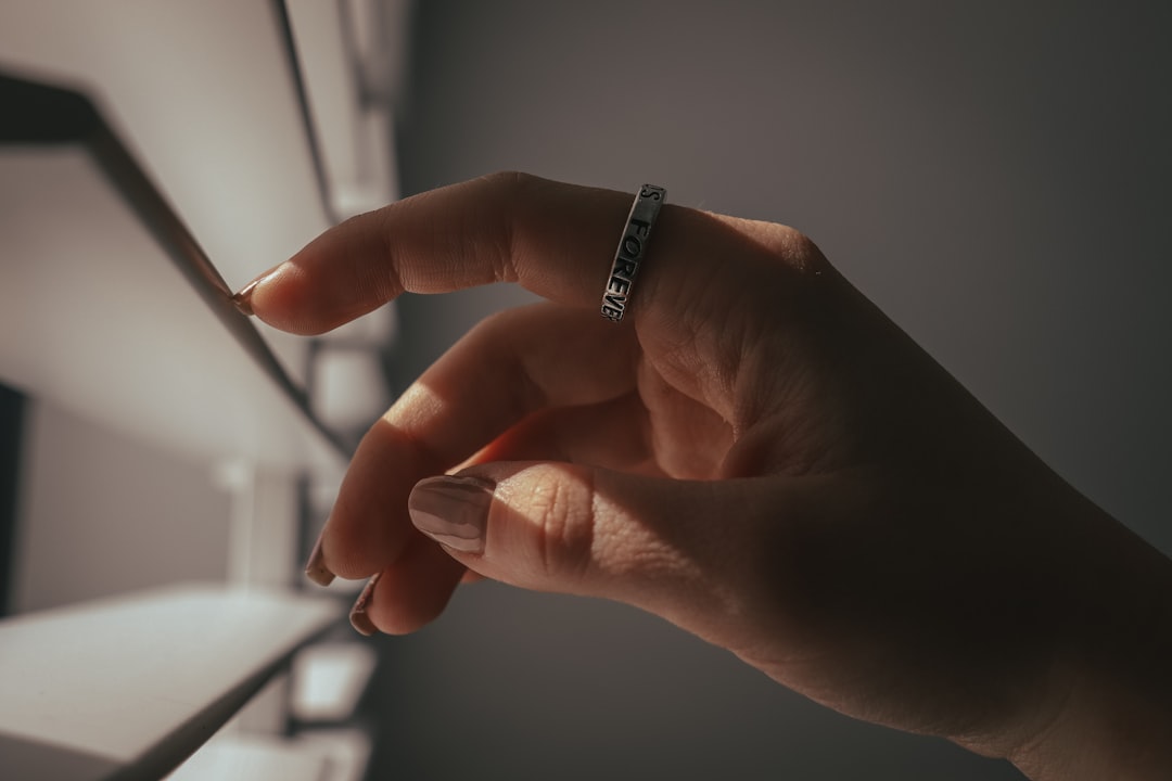 Stylized hands made of digital elements or light, supporting or interacting, representing technological assistance.