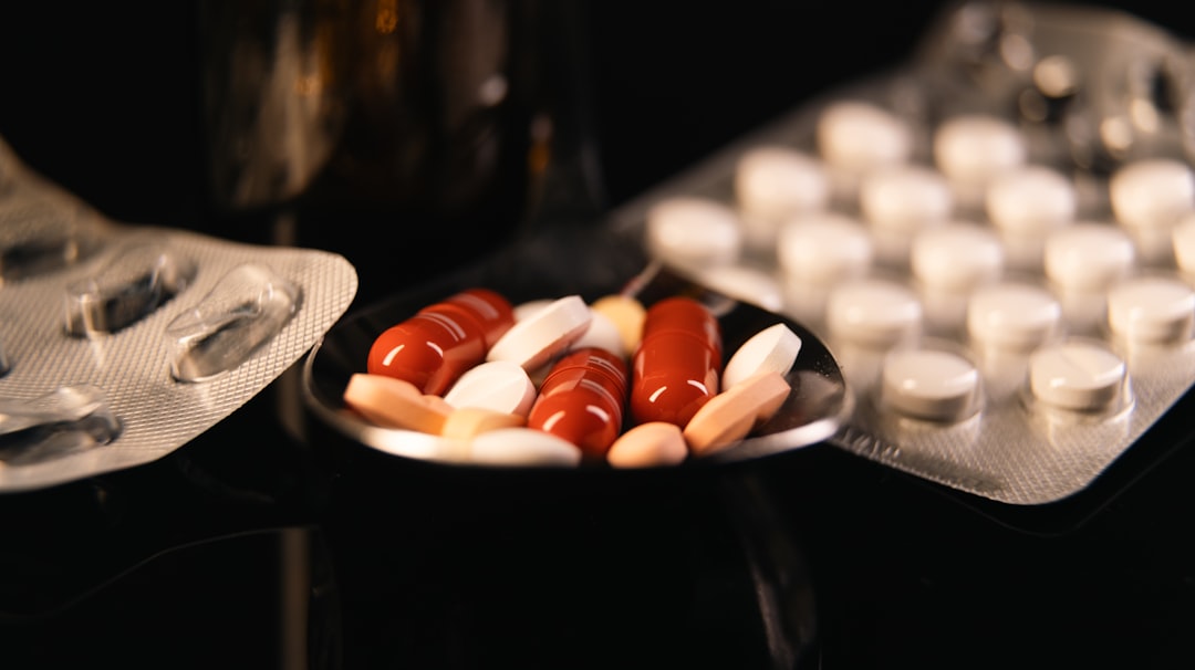 A hand holding pills, symbolizing medication or substance abuse.